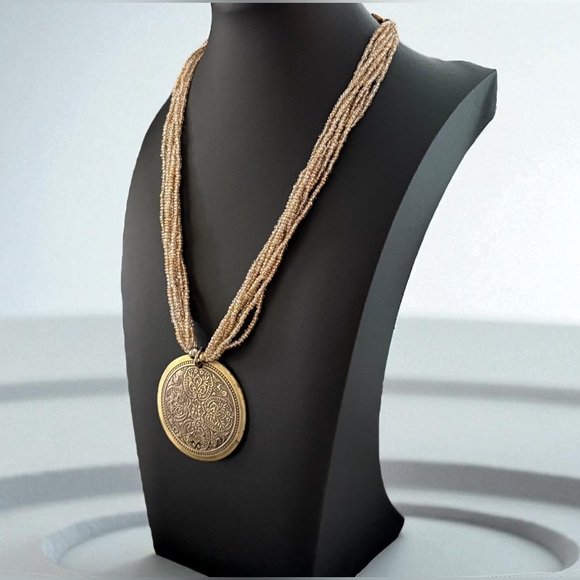 Tribal vintage gold tone 7 strand 16” beaded necklace with round pendant. - Picture 2 of 6